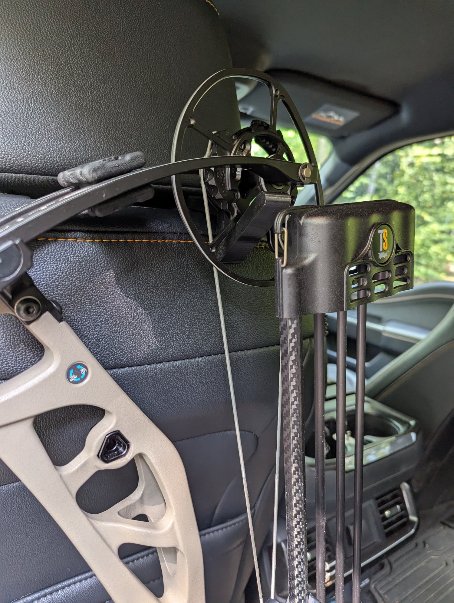 3D Hunting Solutions arrow accessory headrest post bow gear hanger attached to vehicle headrest for easy bow storage.