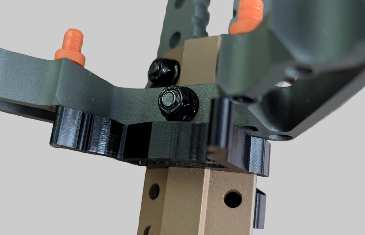 Set of Tethrd Skeletors Stick Wranglers by 3D Hunting Solutions, climbing stick management system with two stacked climbing sticks.