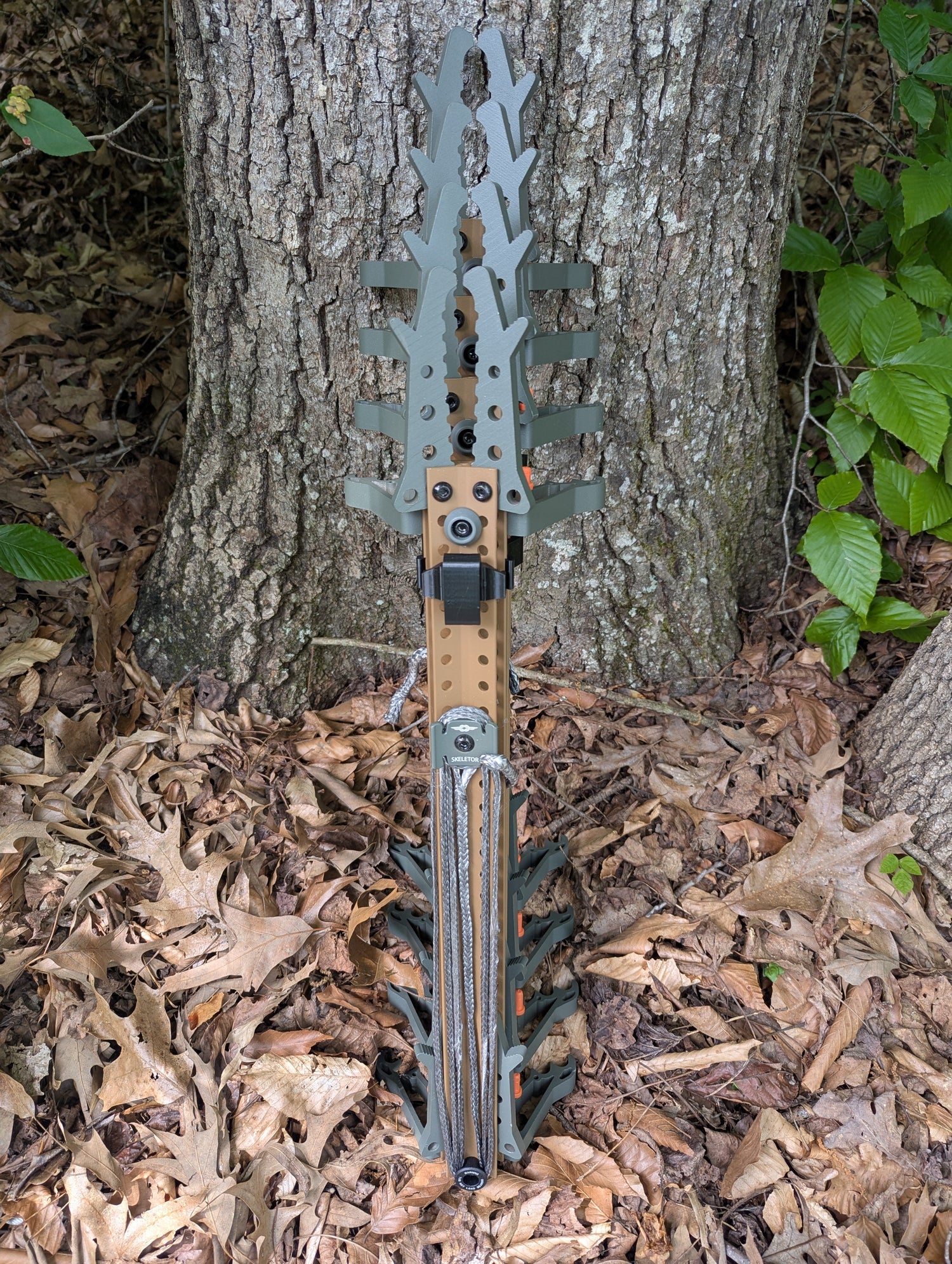 Set of Tethrd Skeletors Stick Wranglers climbing stick management system by 3D Hunting Solutions with two stacked climbing sticks.
