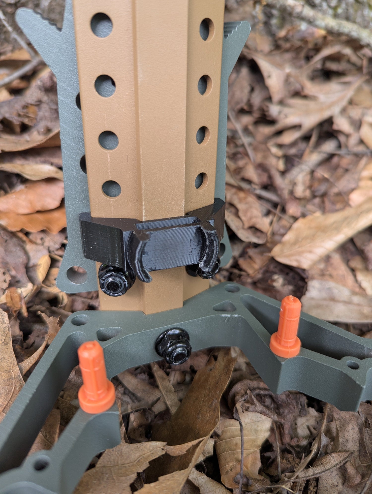 Set of Tethrd Skeletors Stick Wranglers by 3D Hunting Solutions for climbing stick management, featuring two stacked climbing sticks.