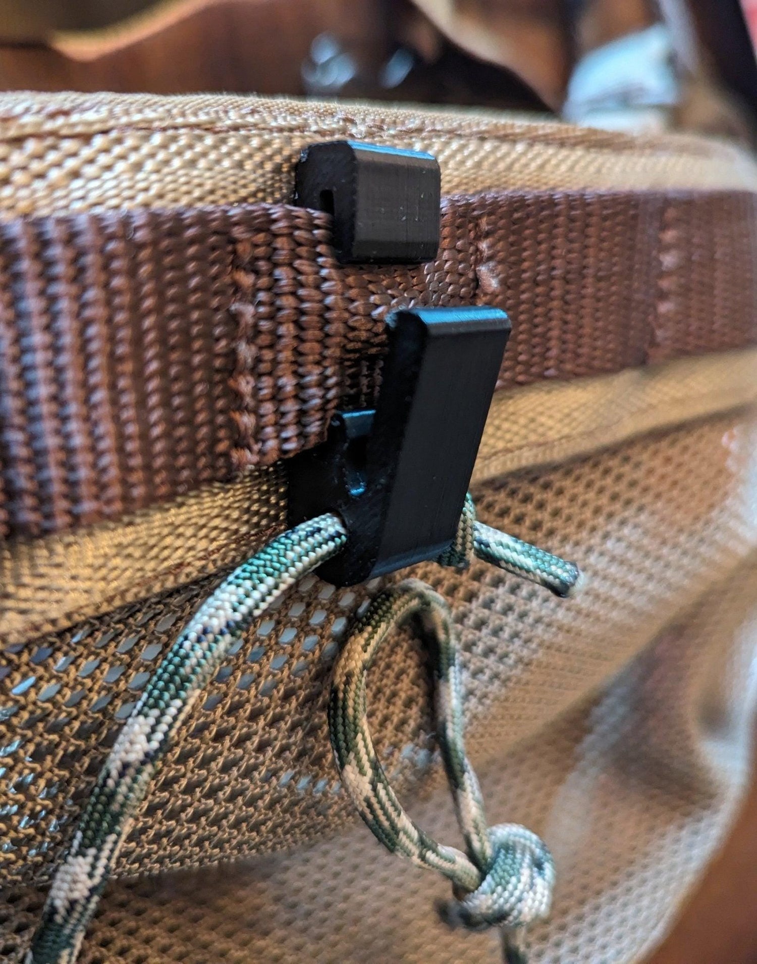 Rope Molle hanger hook for saddle hunting by 3D Hunting Solutions, showing the durable metal hook attached to a rope for gear hanging.