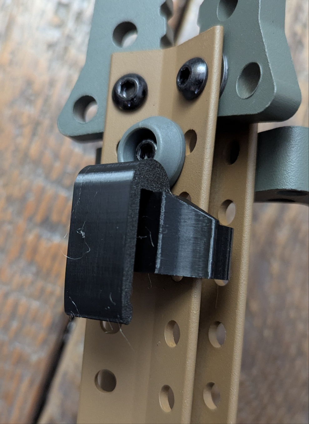 Tethrd Skeletors Stick Caddy for saddle hunting by 3D Hunting Solutions, showing the caddy attached to a climbing stick.