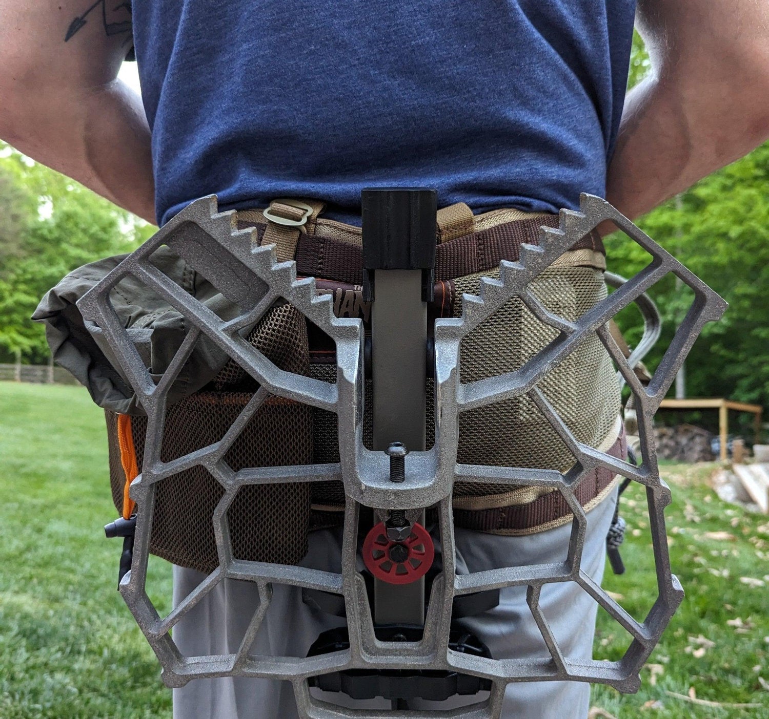 3D Hunting Solutions Saddle Platform Caddy for saddle hunting, shown attached to a hunting saddle with adjustable straps and storage pockets.