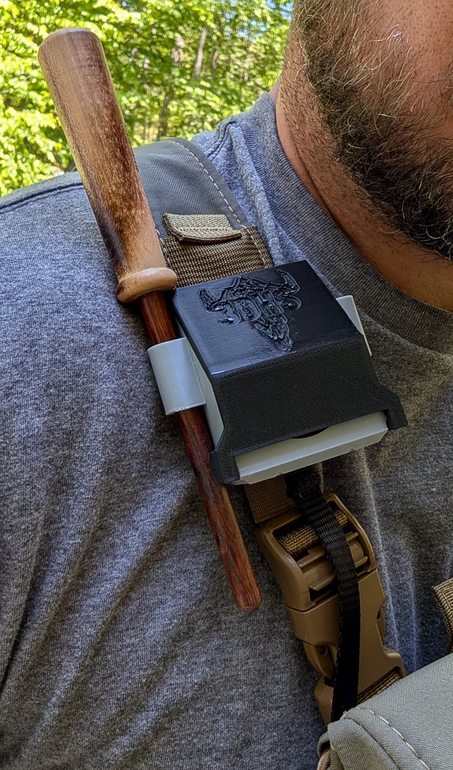 Rut & Strut Mouth Call Caddy for turkey hunting by 3D Hunting Solutions, shown holding call caddy with turkey calls attached.