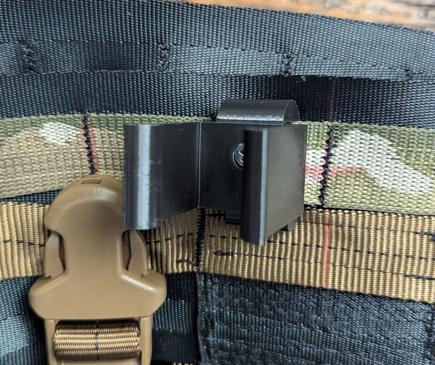 Climbing Stick Molle Caddy for 1-inch square tubing, designed for saddle hunting, by 3D Hunting Solutions, showing vertical mount and Molle straps.