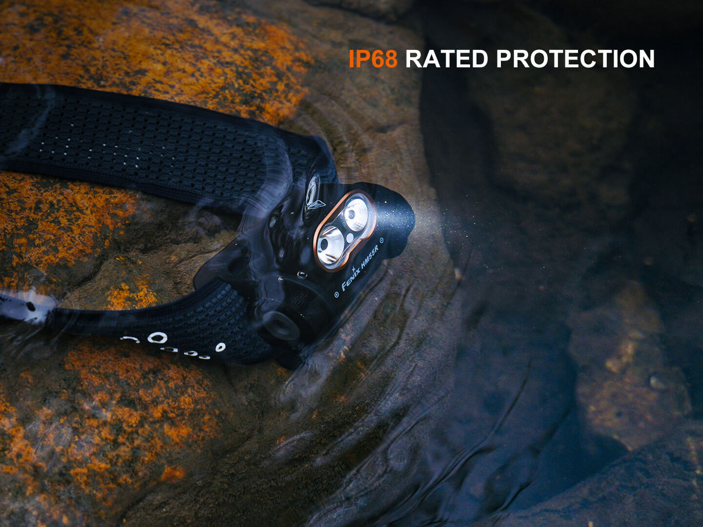 Black Fenix HM55R lightweight multi-LED headlamp with adjustable strap and multiple lighting modes for outdoor activities.