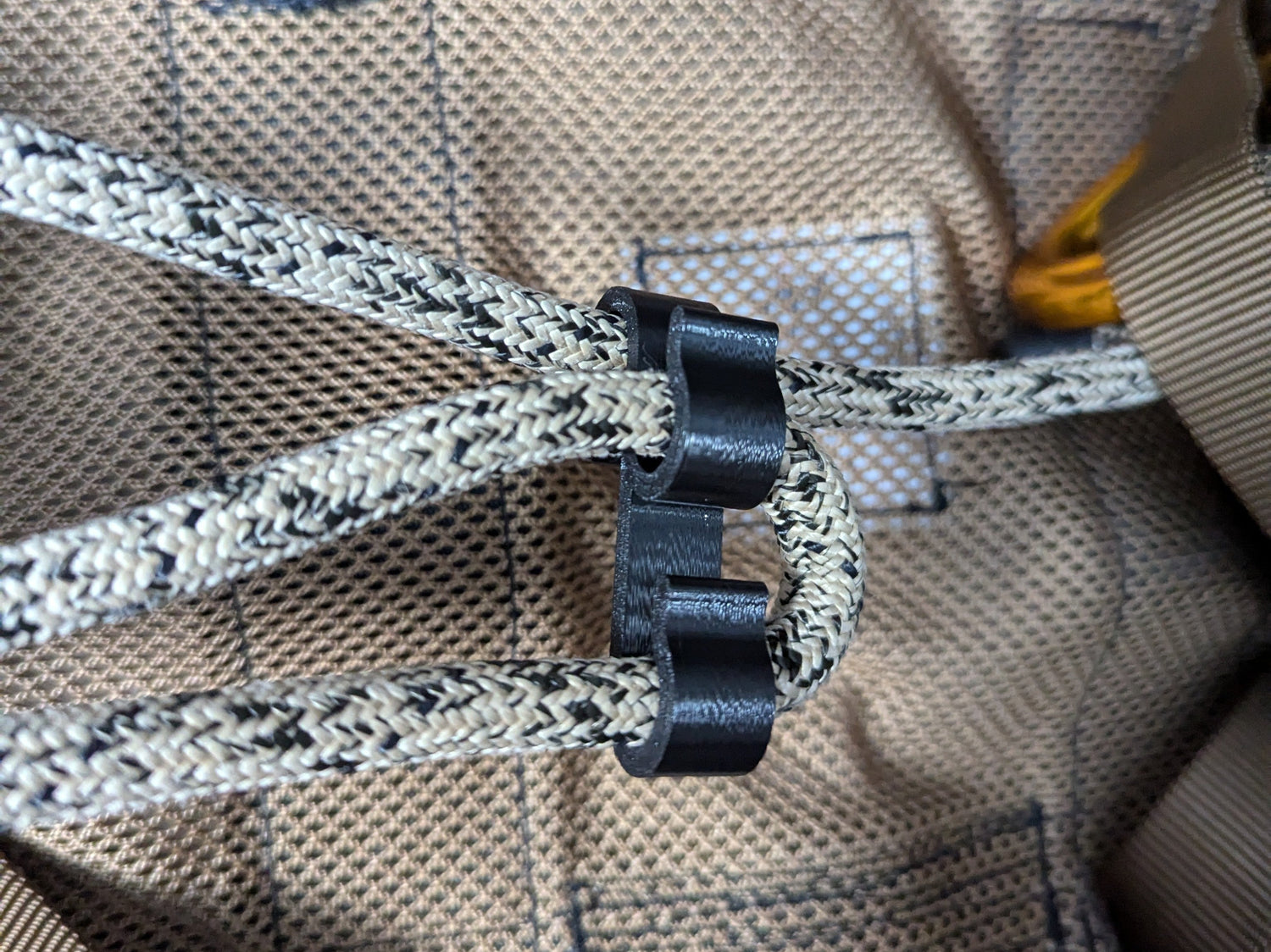 3D Hunting Solutions saddle bridge and rope caddy with hook, designed for secure rope and gear storage during outdoor activities.