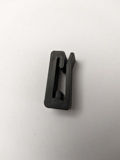 3D Hunting Solutions Molle Hook Hanger for tactical gear, sturdy metal hook attached to a MOLLE panel for secure gear storage.