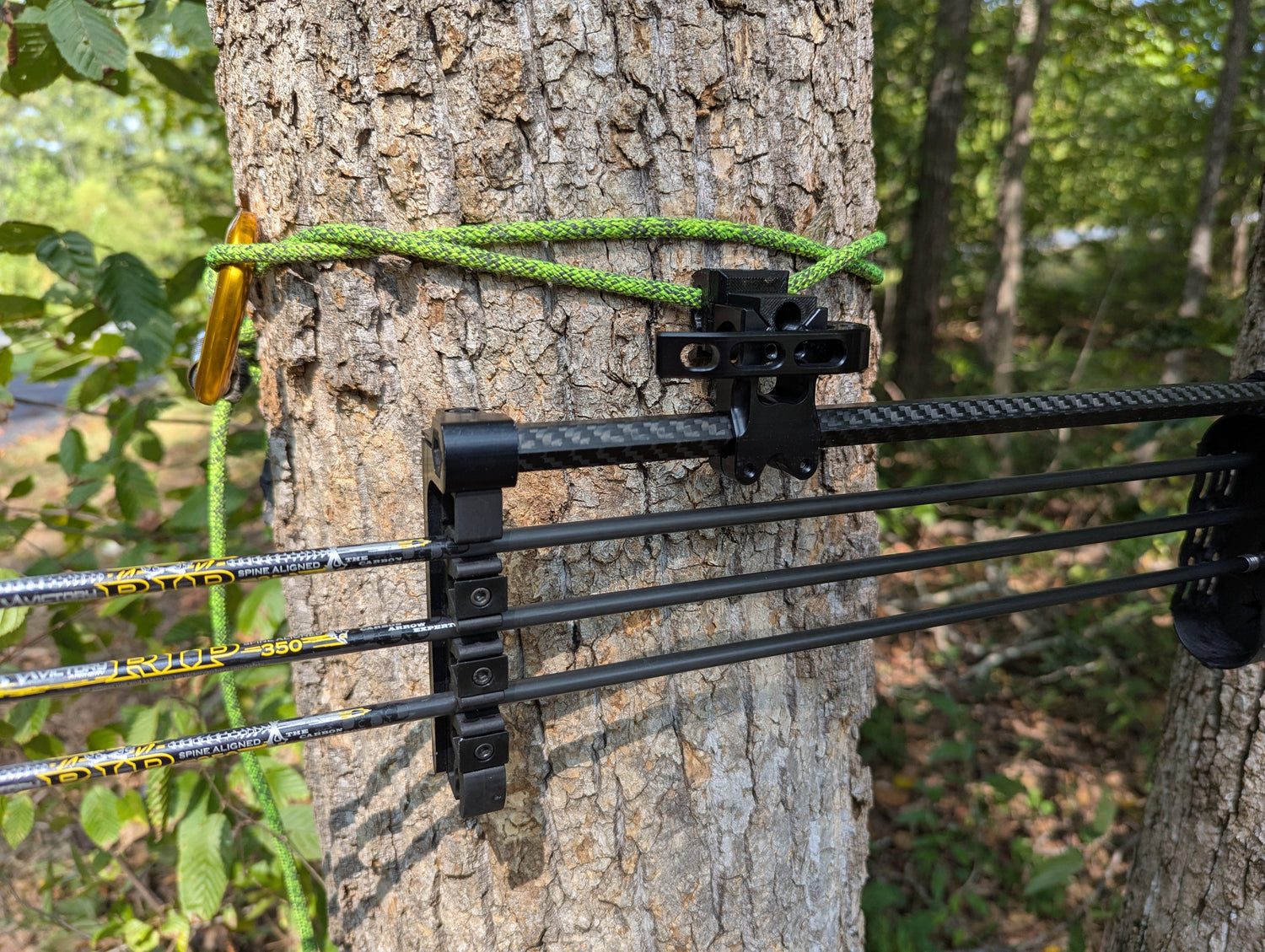 Molle Tight Spot Archery Quiver Caddy by 3D Hunting Solutions mounted on a bow for easy arrow and accessory storage.
