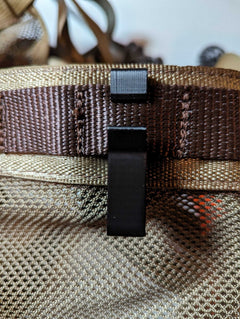 XL Molle hook for saddle hunting from 3D Hunting Solutions, mounted on a saddle, showing durable metal construction and versatile attachment points.