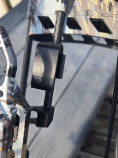 Clip-on archery quiver hanger by 3D Hunting Solutions, showing secure clip and sturdy design for archery gear attachment.
