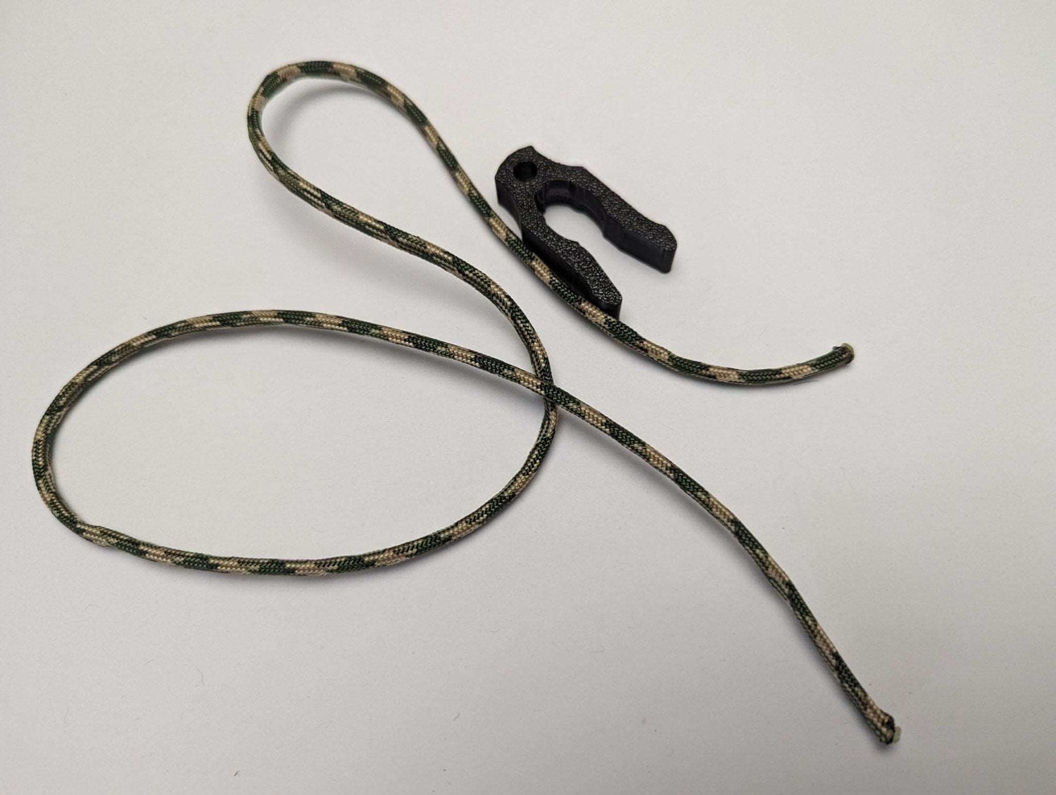 3D Hunting Solutions 8mm tether rope clip for saddle hunting, securing ropes to tree stands and safety harnesses.