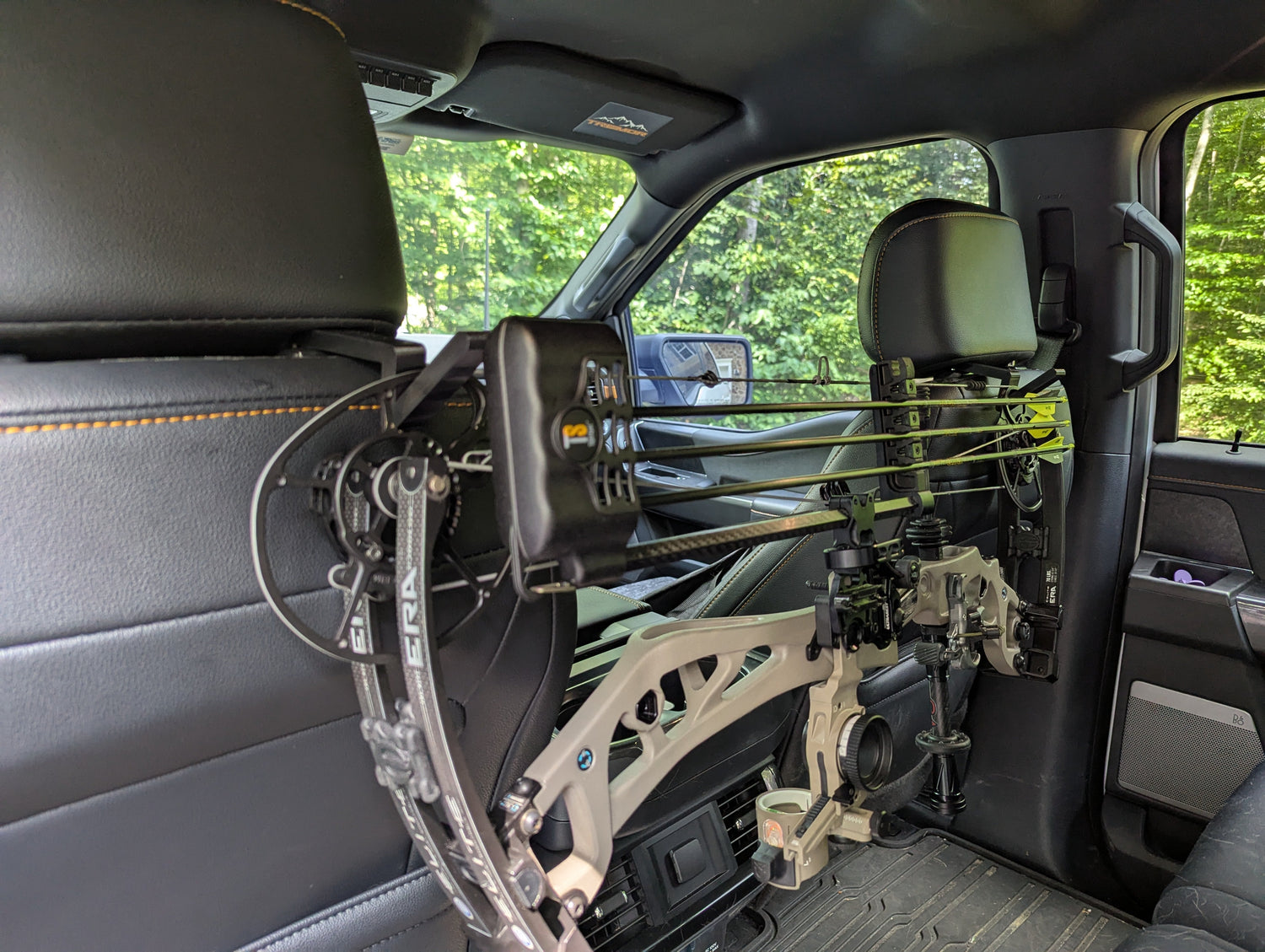 3D Hunting Solutions arrow headrest post with bow and gear hanger for vehicle headrest storage and organization.