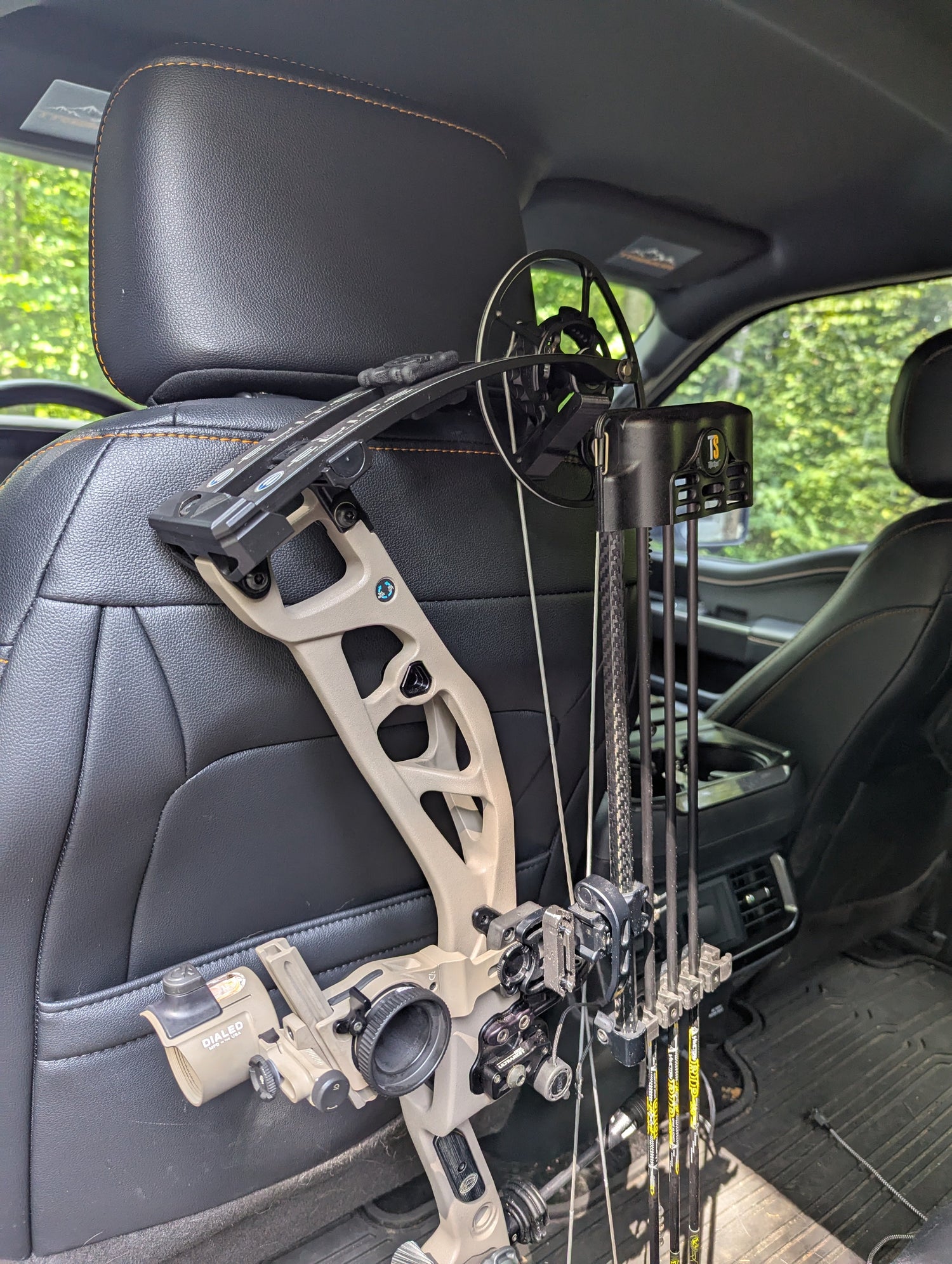 3D Hunting Solutions arrow accessory headrest post gear hanger for bows and hunting gear, mounted on vehicle headrest.