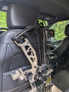 3D Hunting Solutions arrow accessory headrest post gear hanger for bows and hunting gear, mounted on vehicle headrest.