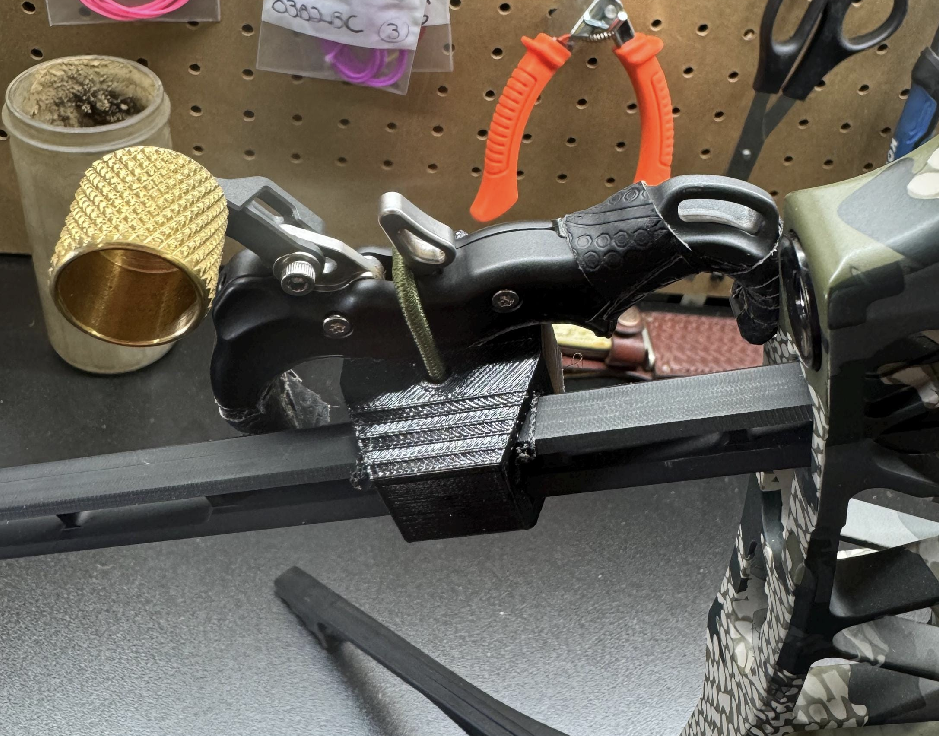 3D Hunting Solutions Bridge Lock Stabilizer Release Holster for thumb releases, designed for bow accessories, shown with a thumb release attached.
