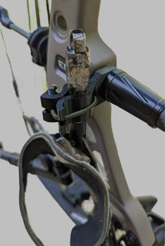 3D Hunting Solutions archery wrist release stabilizer holster for mobile and saddle hunting, attached to a bow for secure gear holding