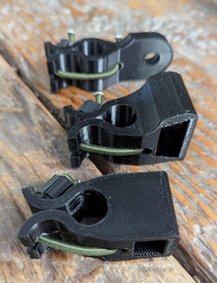 3D Hunting Solutions archery wrist release stabilizer holster for mobile and saddle hunting, shown attached to a bow.