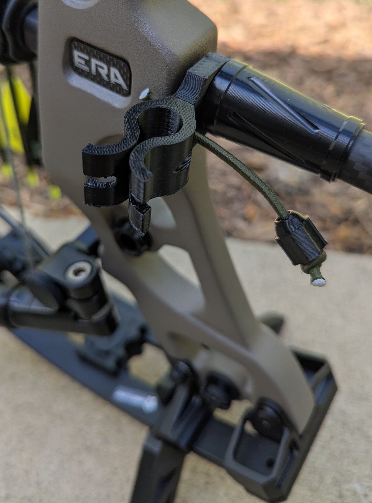 3D Hunting Solutions archery wrist release stabilizer holster for mobile and saddle hunting, attached to a bow.