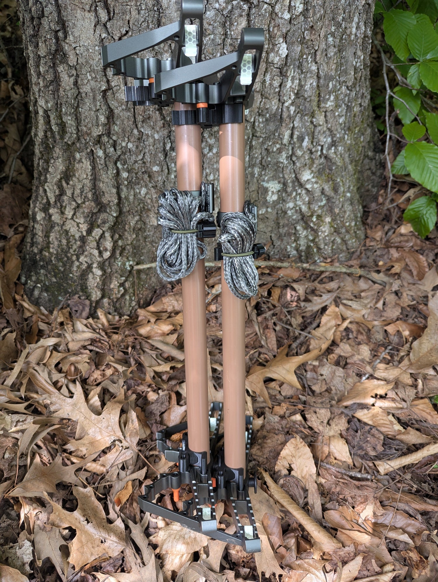 3D Hunting Solutions Tethrd One Stick Wranglers climbing stick stacking system with two climbing sticks for efficient tree stand setup