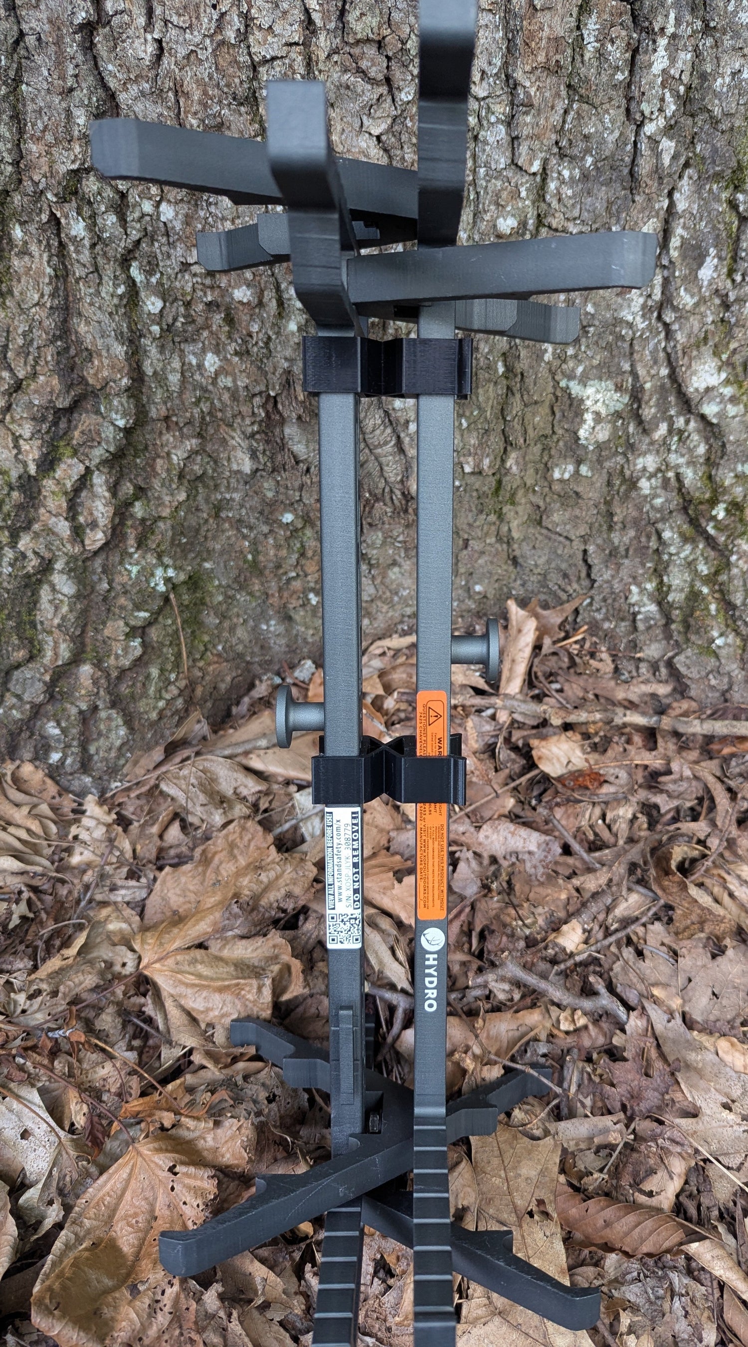 Pair of XOP Hydro Stick Wranglers climbing stick management system by 3D Hunting Solutions for organizing climbing sticks.