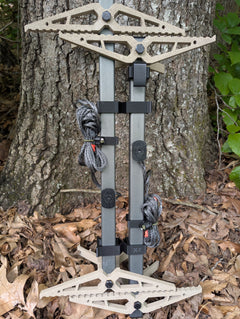 Set of XOP X2 Stick Wranglers climbing sticks by 3D Hunting Solutions showing the climbing stick management system with two stacked climbing sticks.