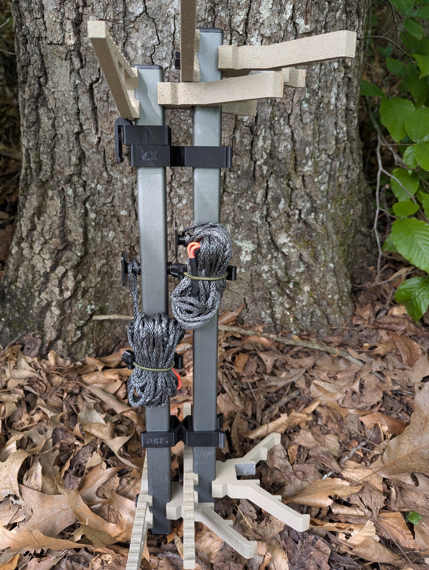 XOP X2 Stick Wranglers climbing stick management system for 3D Hunting Solutions climbing sticks, showing two stacked sticks with straps.