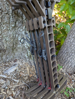 Pair of Trophyline Hyperlite Spool Bumpers on climbing sticks by 3D Hunting Solutions, shown attached to lightweight climbing gear.