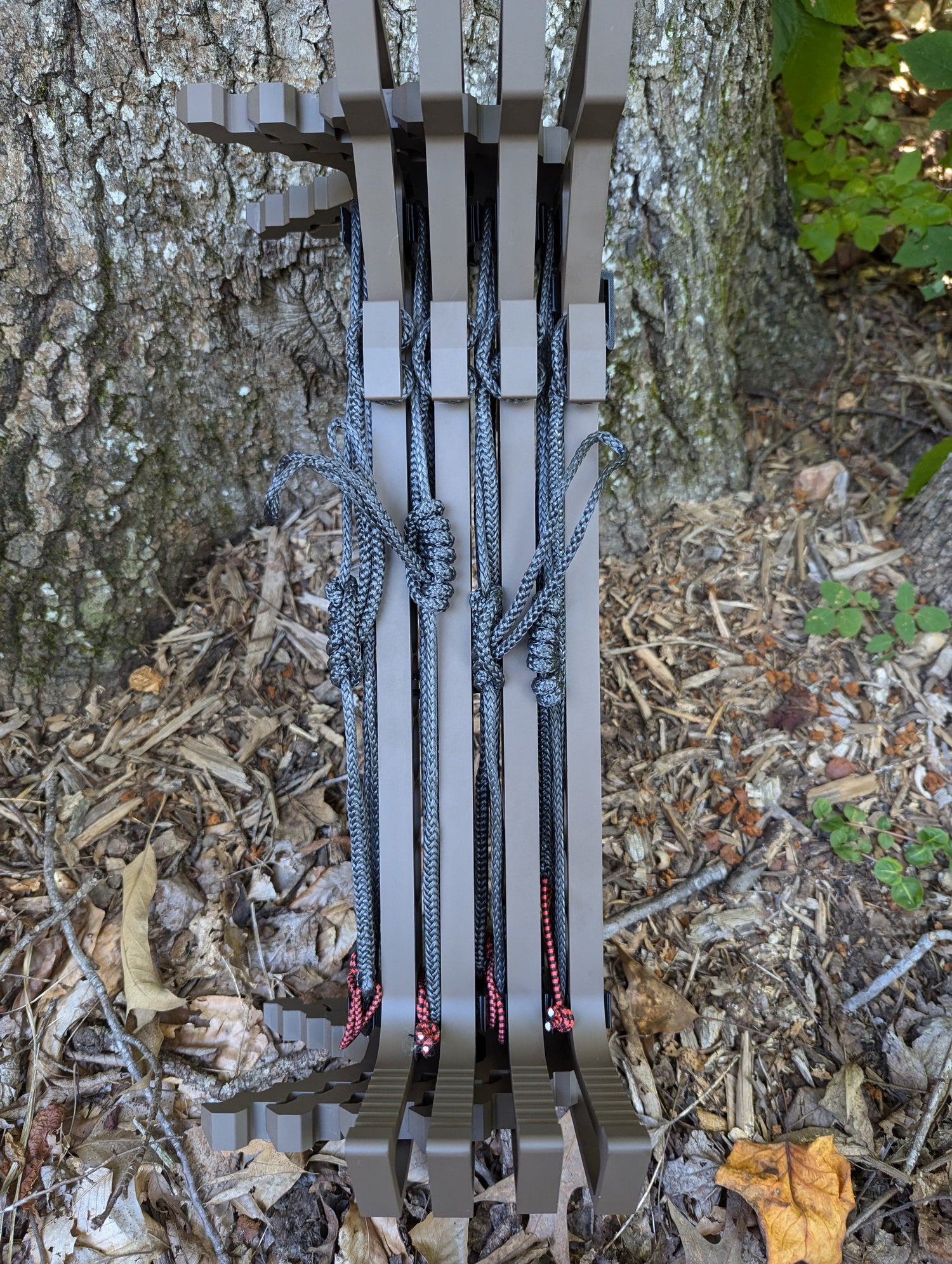 Climbing sticks with Trophyline Hyperlite Spool Bumpers from 3D Hunting Solutions, showing the textured grip and bumper details.