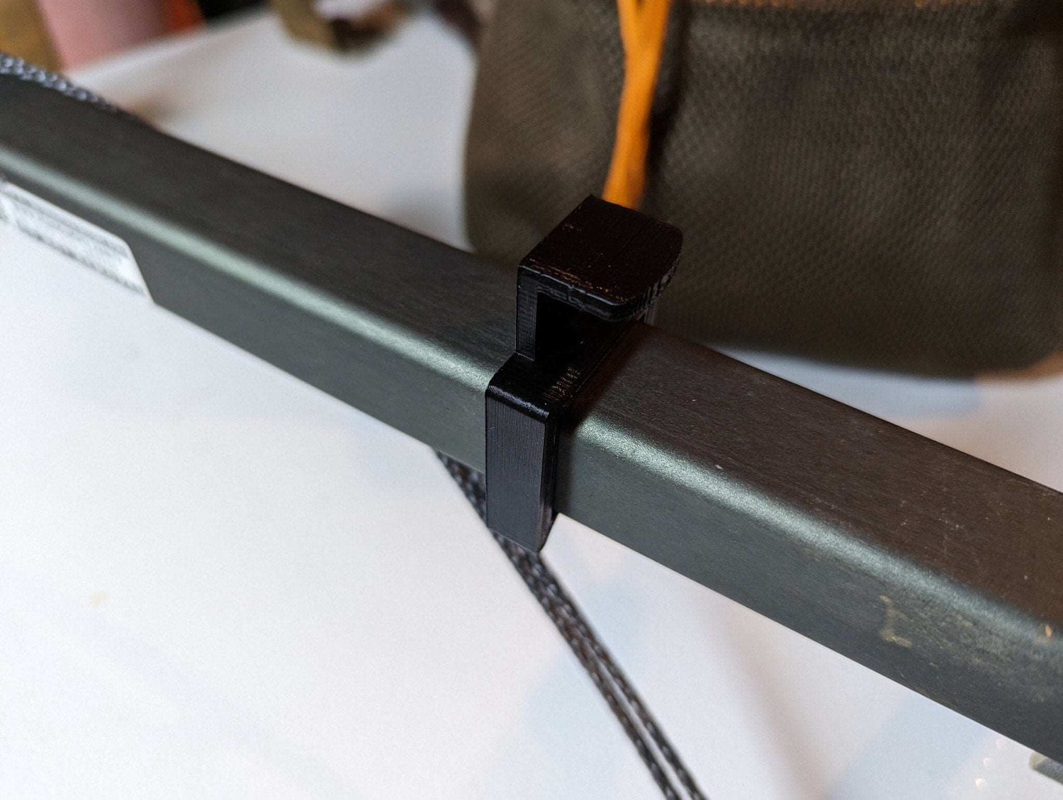 Climbing Stick Amsteel Spooler by 3D Hunting Solutions attached to climbing stick, used for organizing and spooling climbing rope.