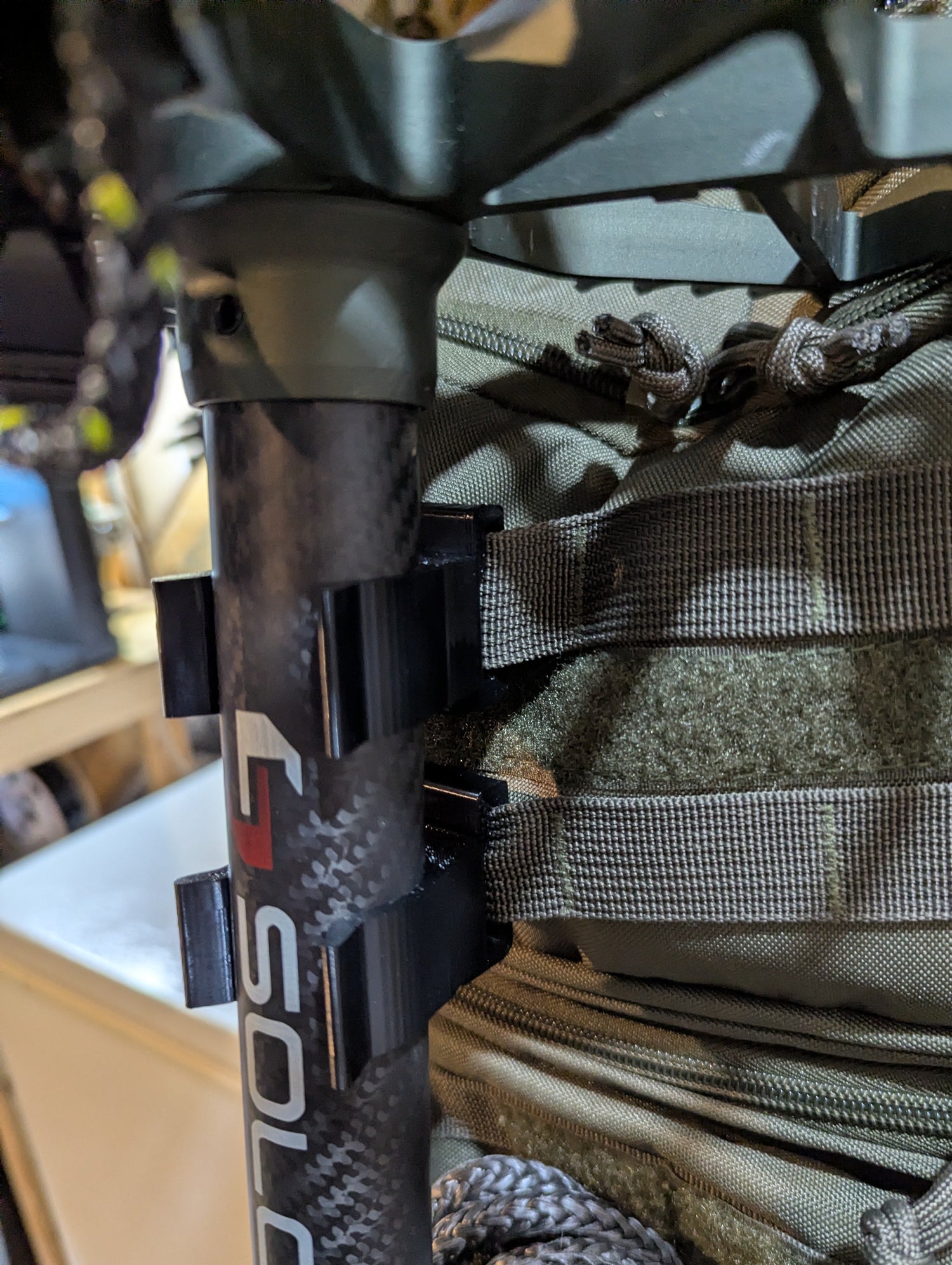 Arsenal X20 Solo Stick Molle Caddy for saddle hunting, 1.25-inch climbing stick from 3D Hunting Solutions, vertical positioning shown