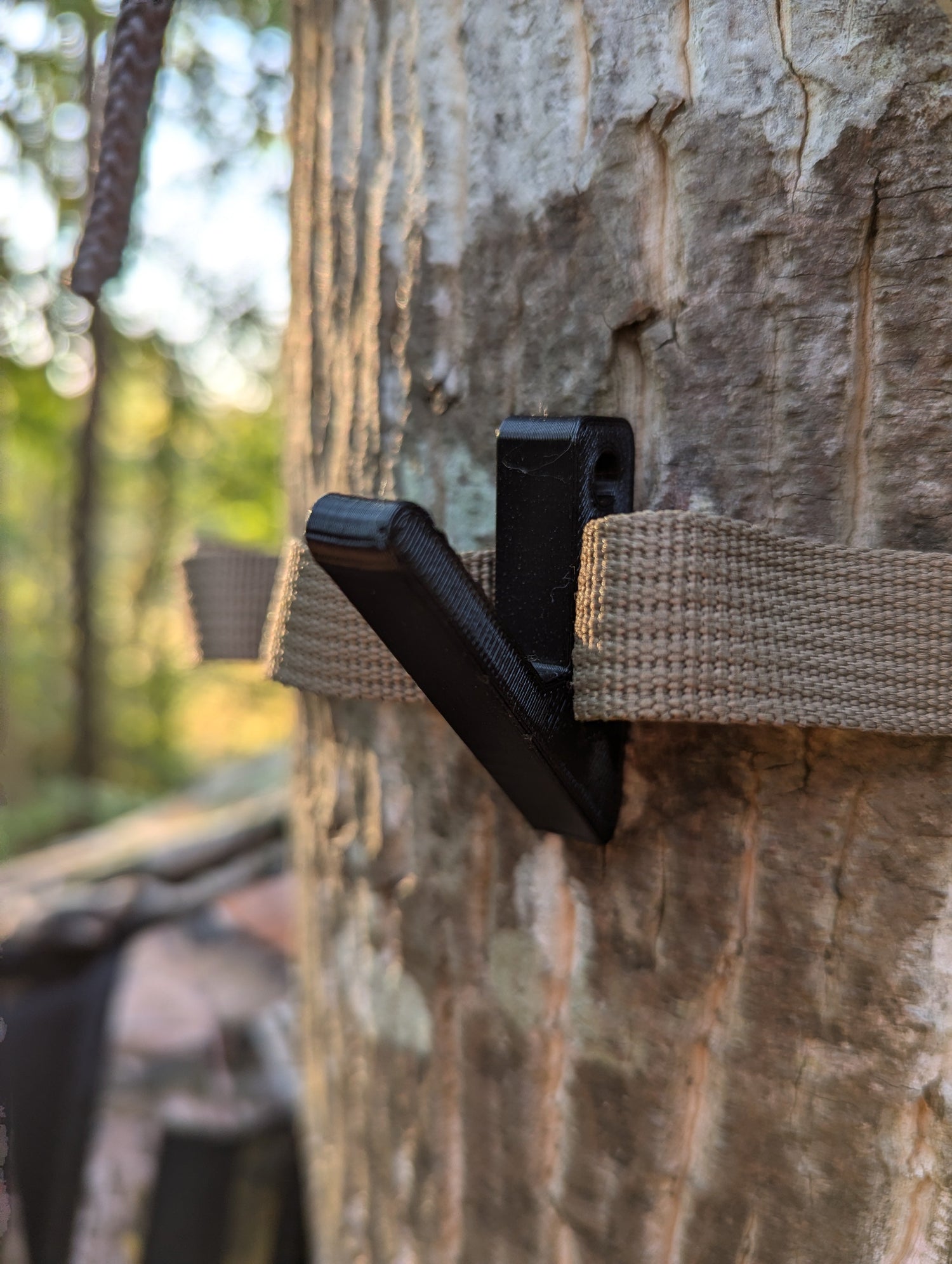 Angled gear hook for saddle hunting by 3D Hunting Solutions, designed for securely hanging gear on hunting saddle.