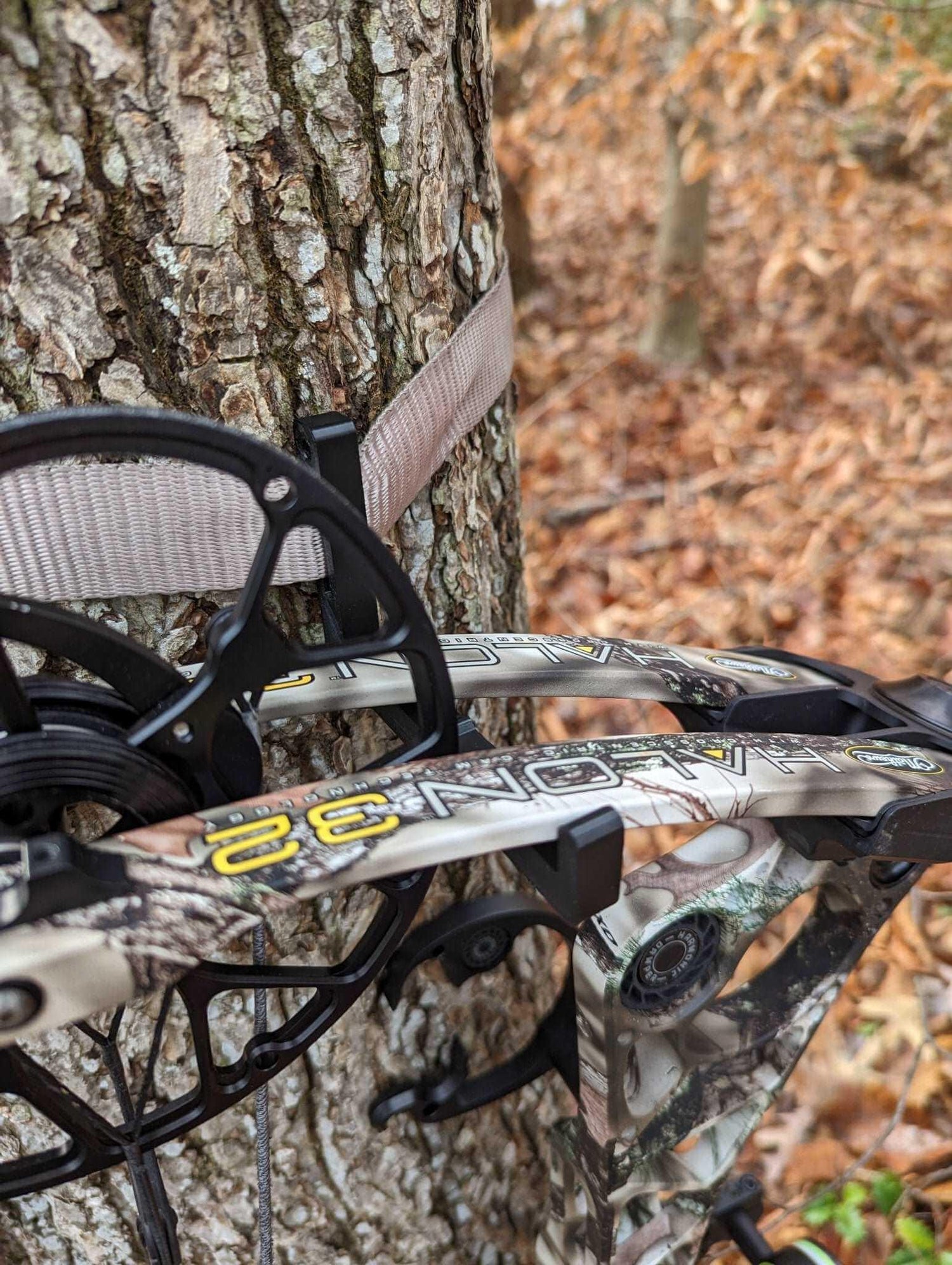 Amsteel strap bow hanger by 3D Hunting Solutions showing a sturdy, adjustable bow storage hook with strap for secure hanging.
