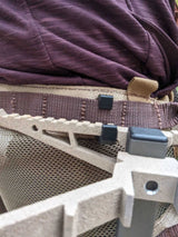 Climbing stick hanger by 3D Hunting Solutions, designed for securely holding climbing sticks in outdoor hunting setups.