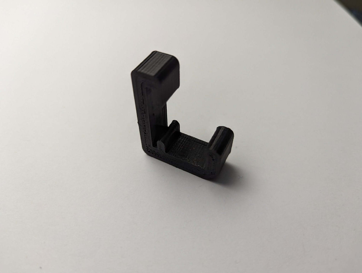 Climbing stick hanger from 3D Hunting Solutions, designed to securely hold climbing sticks for hunting or outdoor activities.