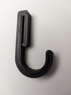 3D Hunting Solutions Gear Strap Hook with durable metal hook for secure gear attachment, shown in close-up with black strap.