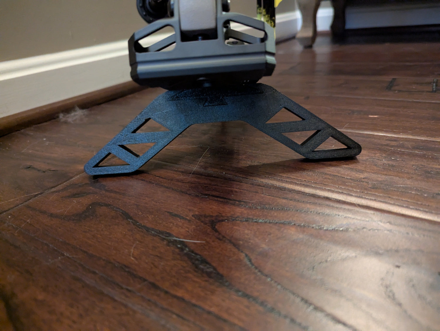 Split limb bow stand by 3D Hunting Solutions, showing a sturdy metal stand designed for holding a split limb bow securely.