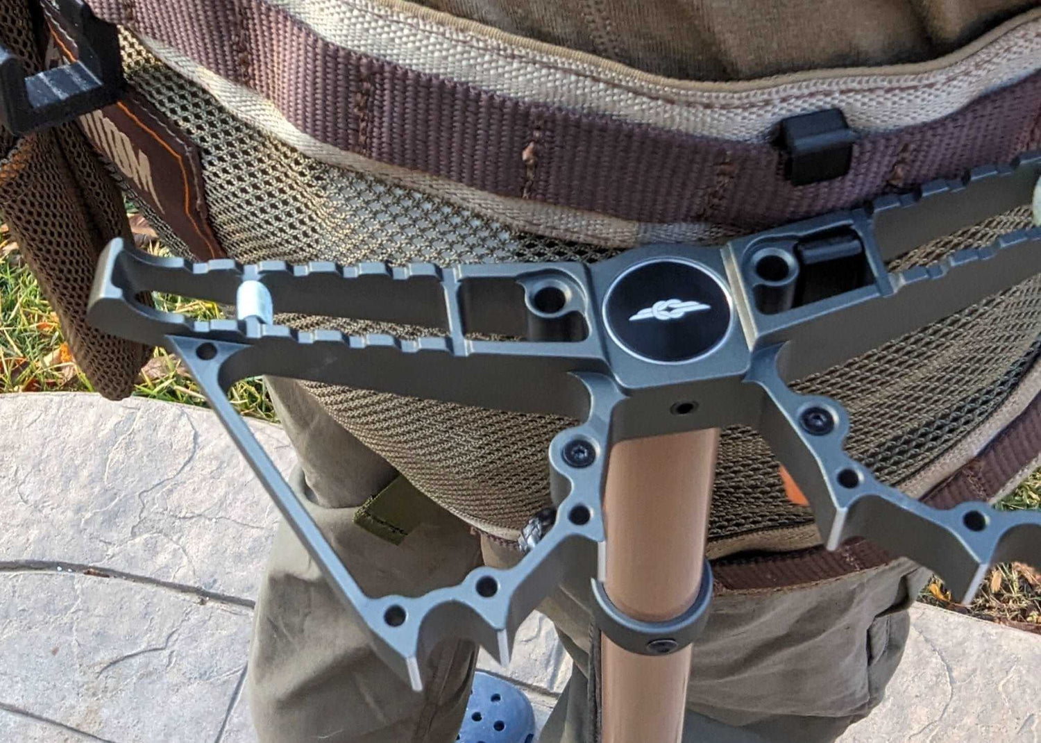 3D Hunting Solutions Tethrd One Skeletors climbing stick hanger mounted on a tree for secure gear hanging.