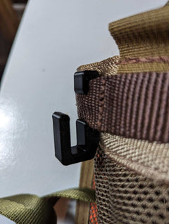 3D Hunting Solutions Tethrd One Skeletors climbing stick hanger mounted on a tree for secure hang storage.