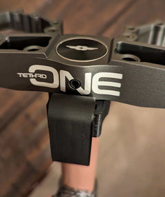 Tethrd One Stick Caddy for saddle hunting by 3D Hunting Solutions, showing the compact carrying accessory attached to a saddle.