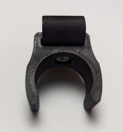 Tethrd One Stick Caddy for saddle hunting by 3D Hunting Solutions, shown attached to a tree for secure gear storage.