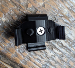 3D Hunting Solutions Skeletors Stick Caddy for saddle hunting mounted on tree, designed for carrying gear during outdoor hunting.