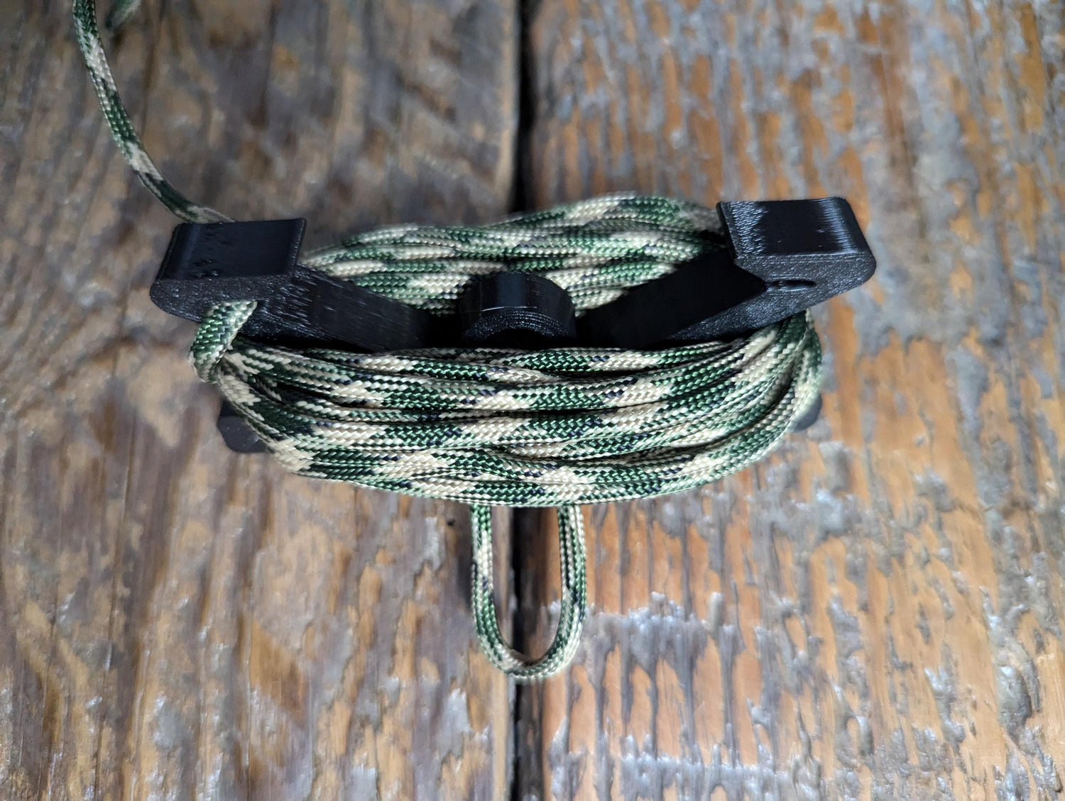 Multi spool gear hoist by 3D Hunting Solutions designed for saddle hunting, featuring durable construction and multiple spools for gear management.