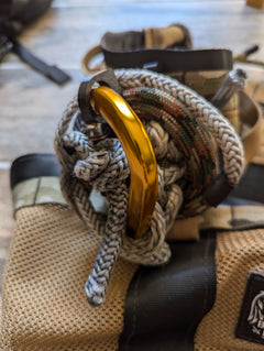 3D Hunting Solutions gear hoist with multi-spool rope keeper designed for saddle hunting, showing the compact rope organization tool.