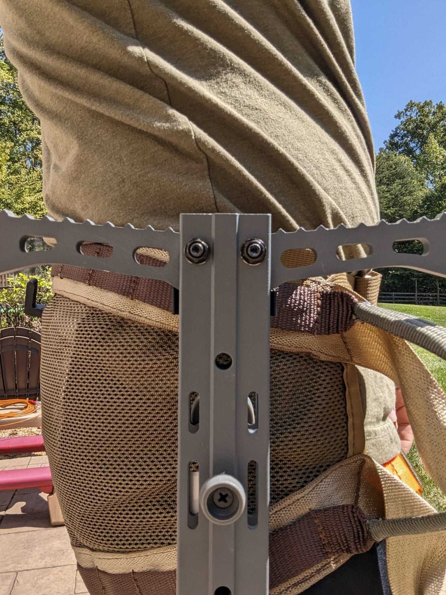Hawk Helium Stick Caddy for saddle hunting by 3D Hunting Solutions, showing the portable caddy attached to a climbing stick for easy transport.