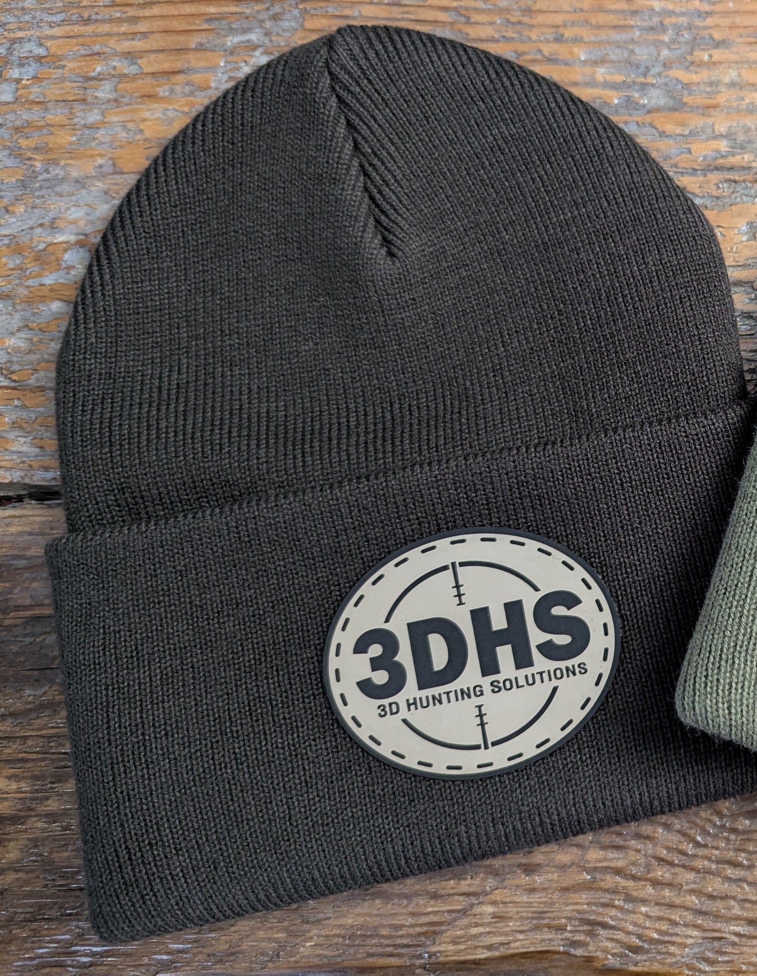 Brown 3DHS Crosshair Beanie hat from 3D Hunting Solutions featuring a logo and comfortable knit design.