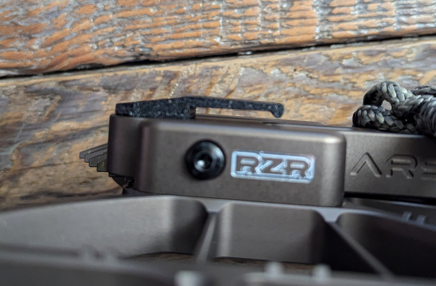 Arsenal RZR Molle Clip, 3D Hunting Solutions platform accessory, shown attached to tactical gear for secure Molle system connection.