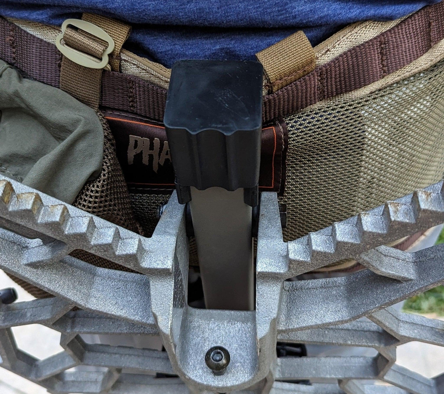 3D Hunting Solutions saddle platform caddy for saddle hunting, shown attached to a hunting saddle in outdoor setting