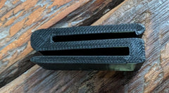 Rut & Strut Mouth Call Caddy for turkey hunting by 3D Hunting Solutions, holding turkey mouth calls in a natural outdoor setting.