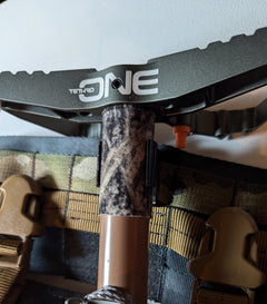 Vertical Tethrd One Molle Caddy for saddle hunting by 3D Hunting Solutions, attached to a saddle with gear slots visible.